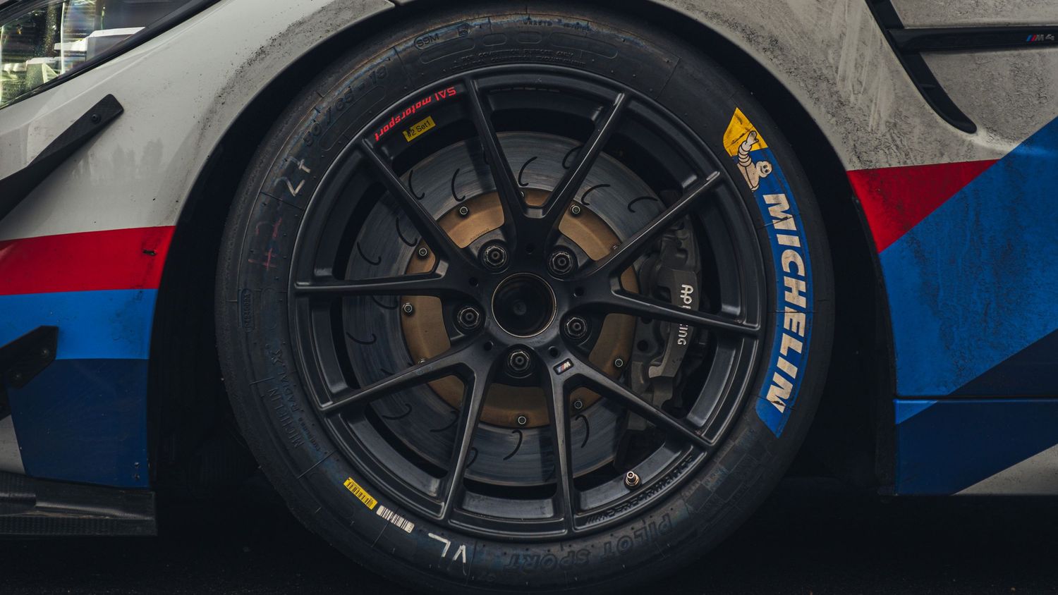 Close-up of performance racing wheels and brake system on BMW M4 GT3.