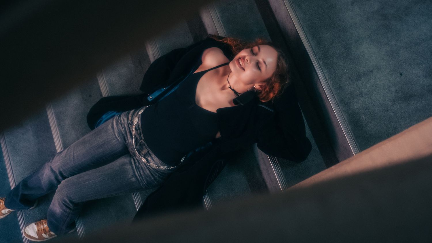 Dark moody sequence showing figure in shadows with dramatic lighting.