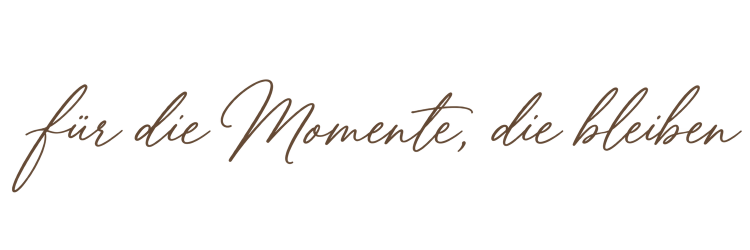 Elegant cursive script text reading 'für die Momente, die bleiben' in warm brown on white background.