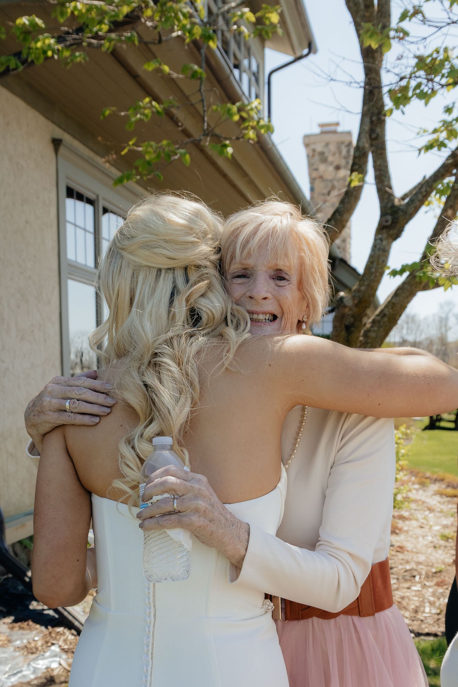 Candid and styled wedding detail shots at Rush Creek Golf Course in Maple Grove, MN, featuring emotional moments with friends and family