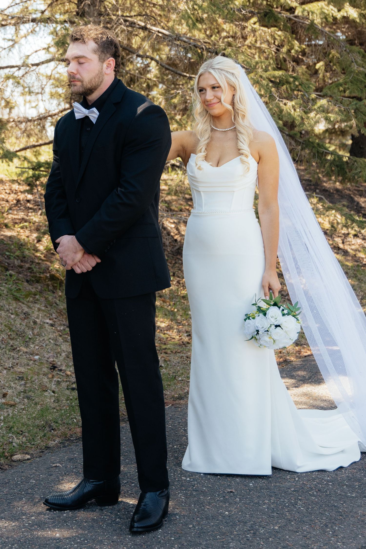 Bride and groom sharing a romantic moment at Rush Creek Golf Course in Maple Grove, MN, with rolling fairways and elegant floral decor