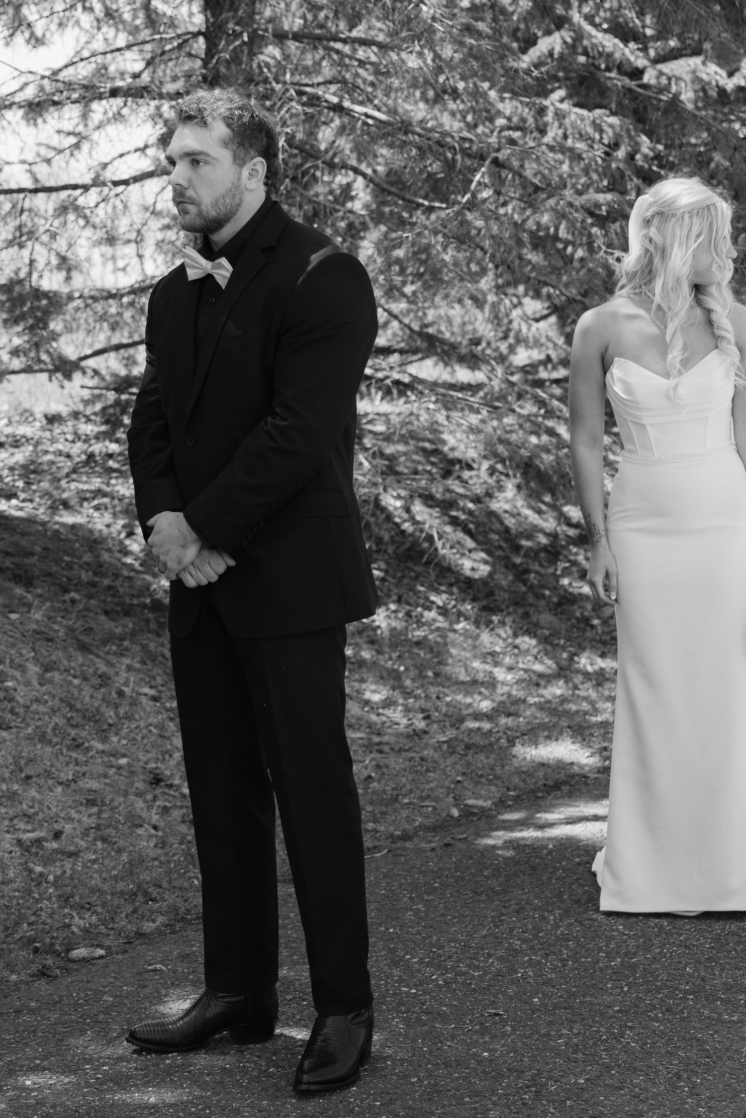 Bride and groom sharing a romantic moment at Rush Creek Golf Course in Maple Grove, MN, with rolling fairways and elegant floral decor