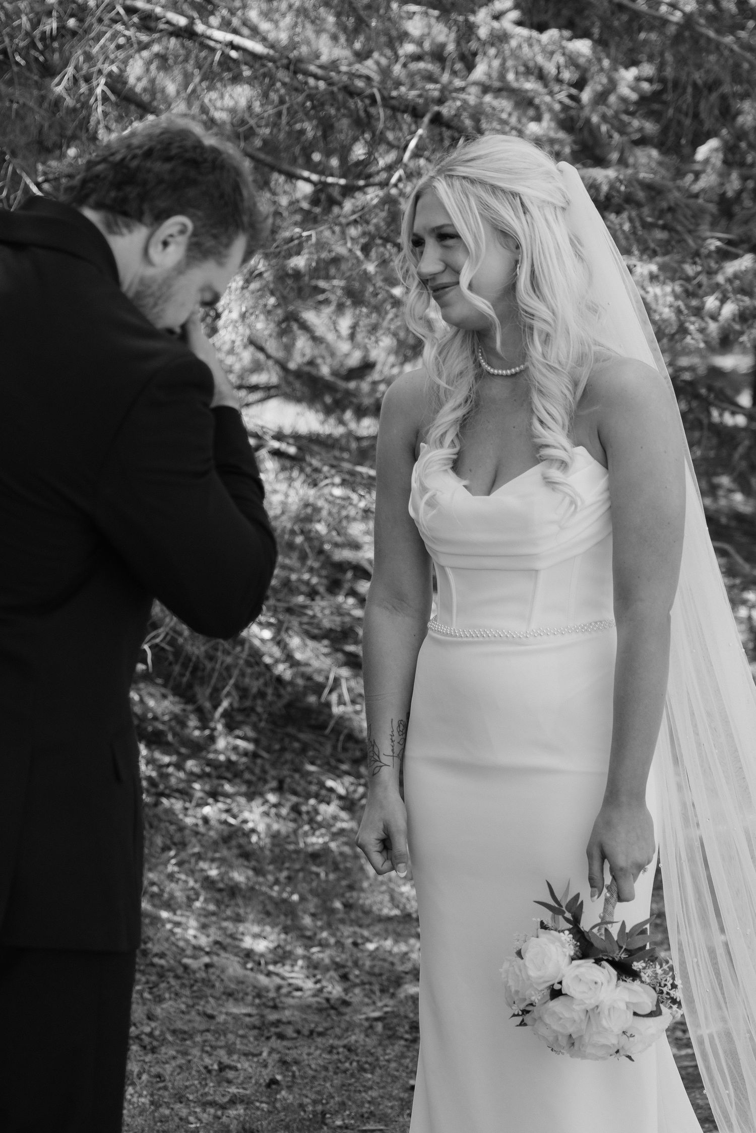 Bride and groom sharing a romantic moment at Rush Creek Golf Course in Maple Grove, MN, with rolling fairways and elegant floral decor