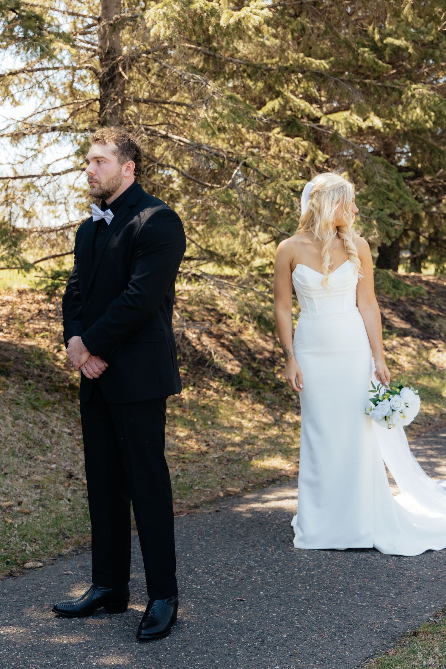 Bride and groom sharing a romantic moment at Rush Creek Golf Course in Maple Grove, MN, with rolling fairways and elegant floral decor