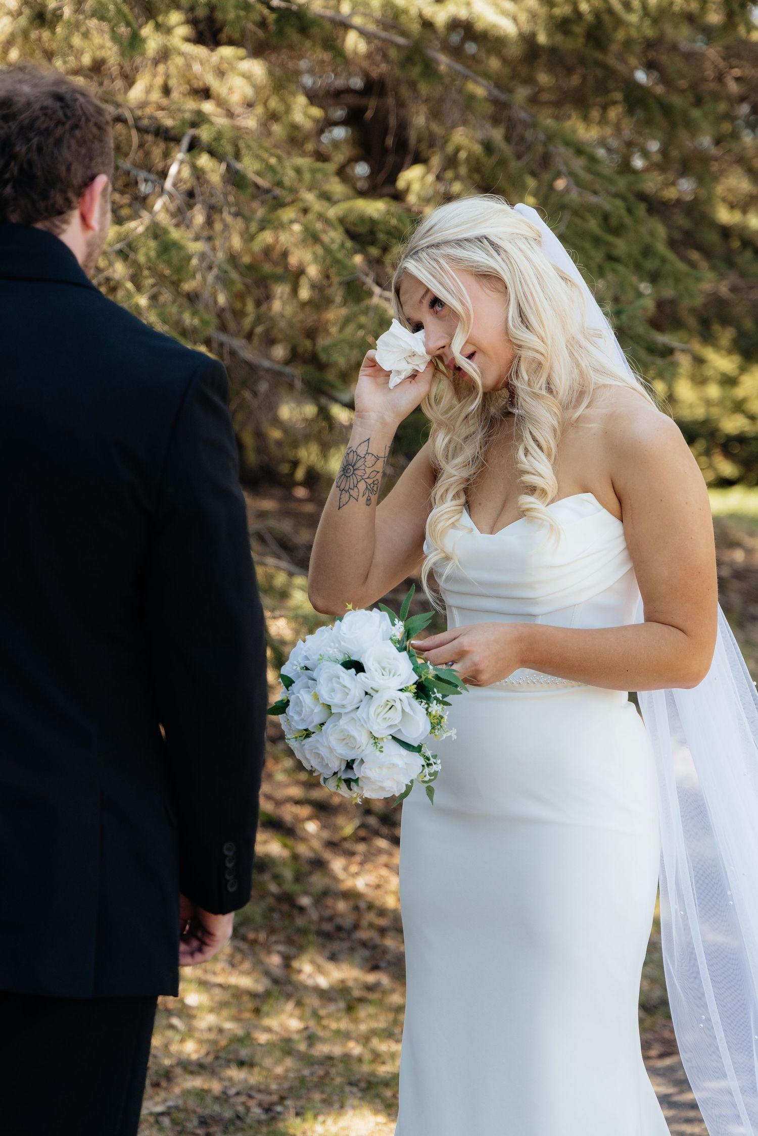 Bride and groom sharing a romantic moment at Rush Creek Golf Course in Maple Grove, MN, with rolling fairways and elegant floral decor