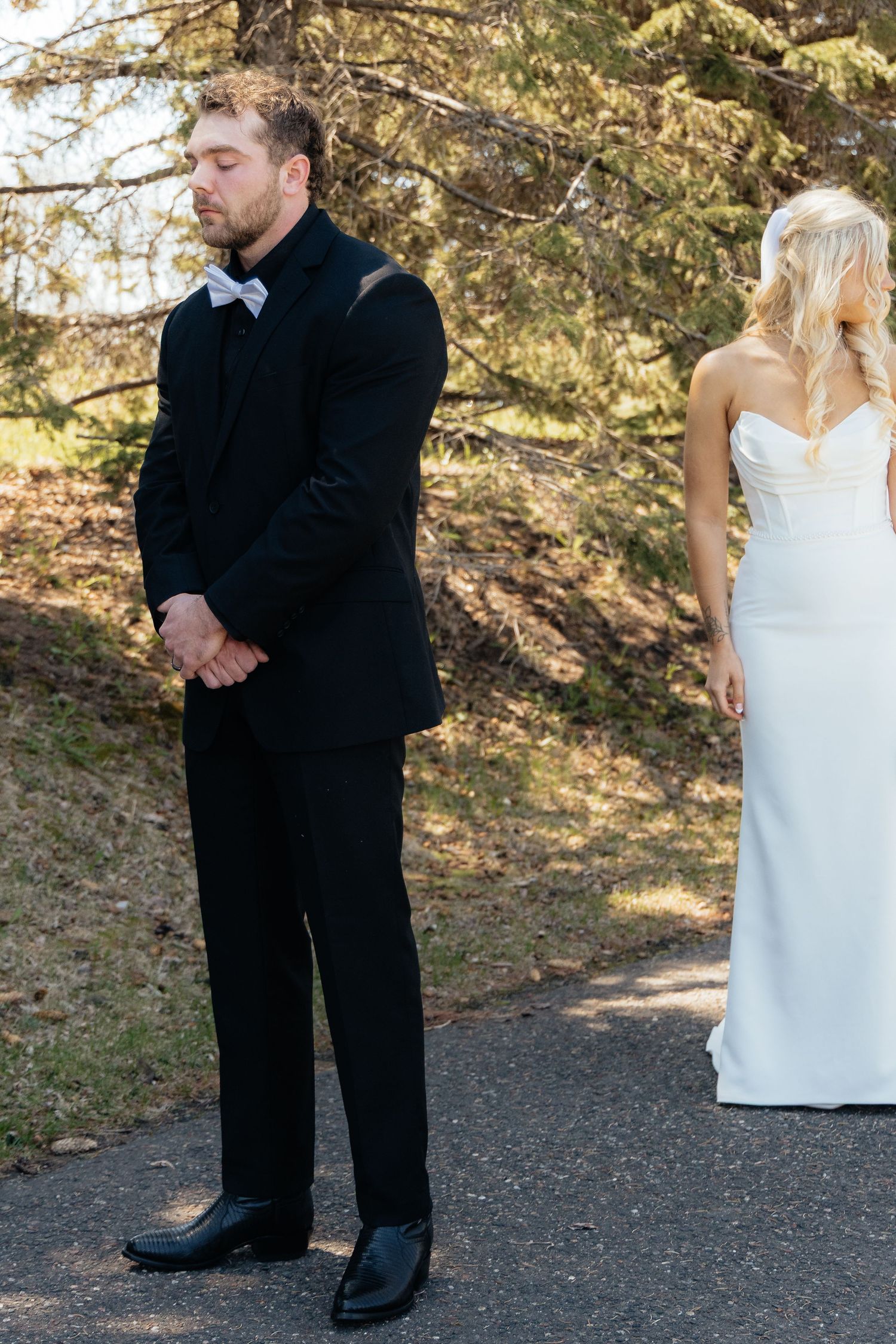 Bride and groom sharing a romantic moment at Rush Creek Golf Course in Maple Grove, MN, with rolling fairways and elegant floral decor