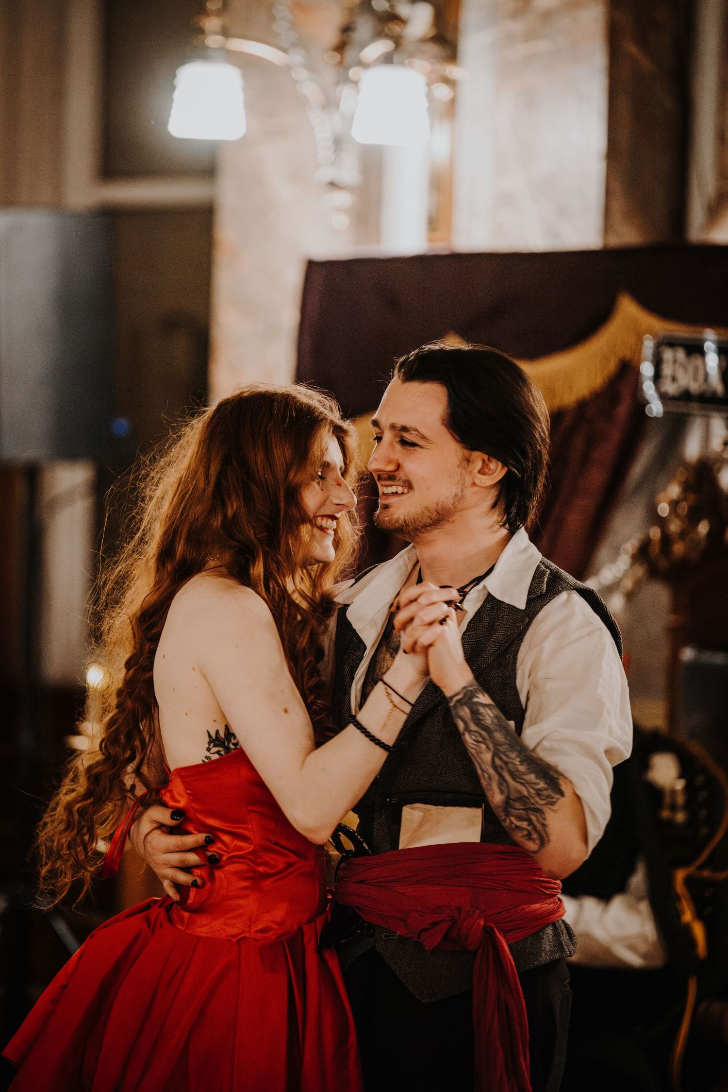 A couple shares intimate moments in a sequence of romantic poses, with the woman wearing a striking red dress at a fantasy ball.