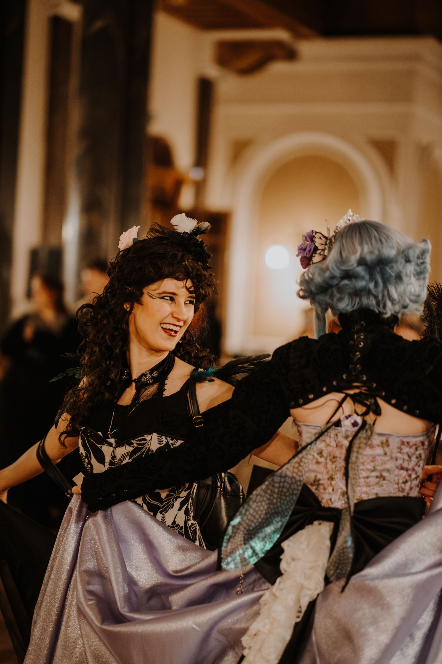 Sequence of dance moves showing a person in a flowing dress twirling and spinning at a fantasy ball.