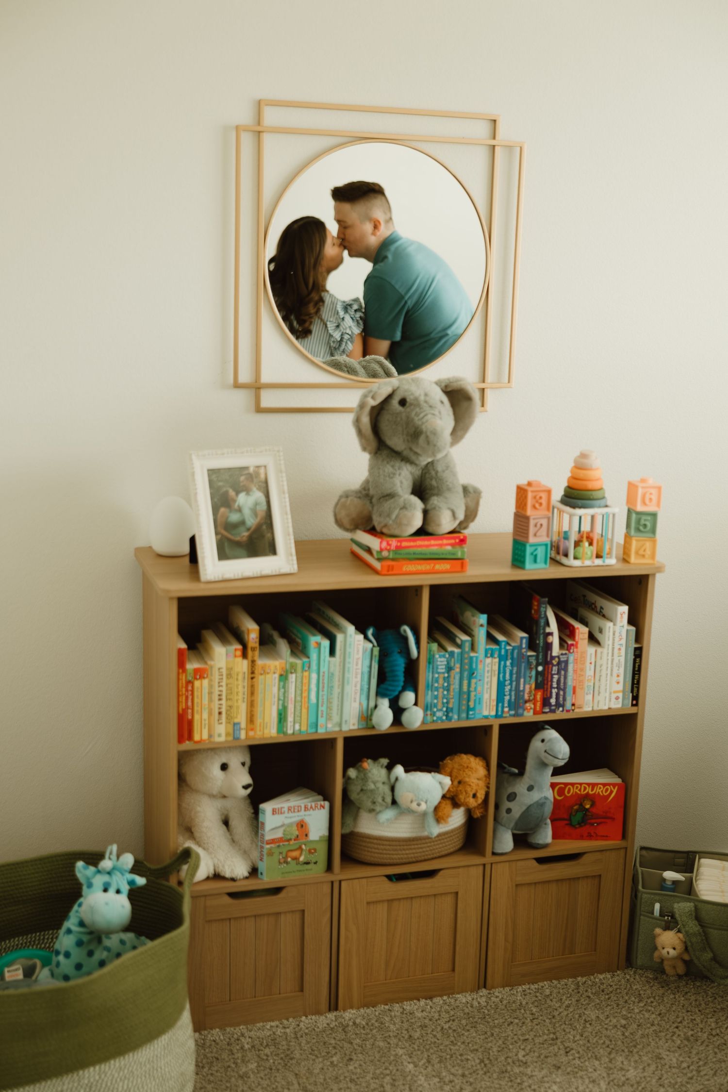 A sequence of photos showing a teddy bear climbing through a mirror frame on a wooden bookshelf with children's books.