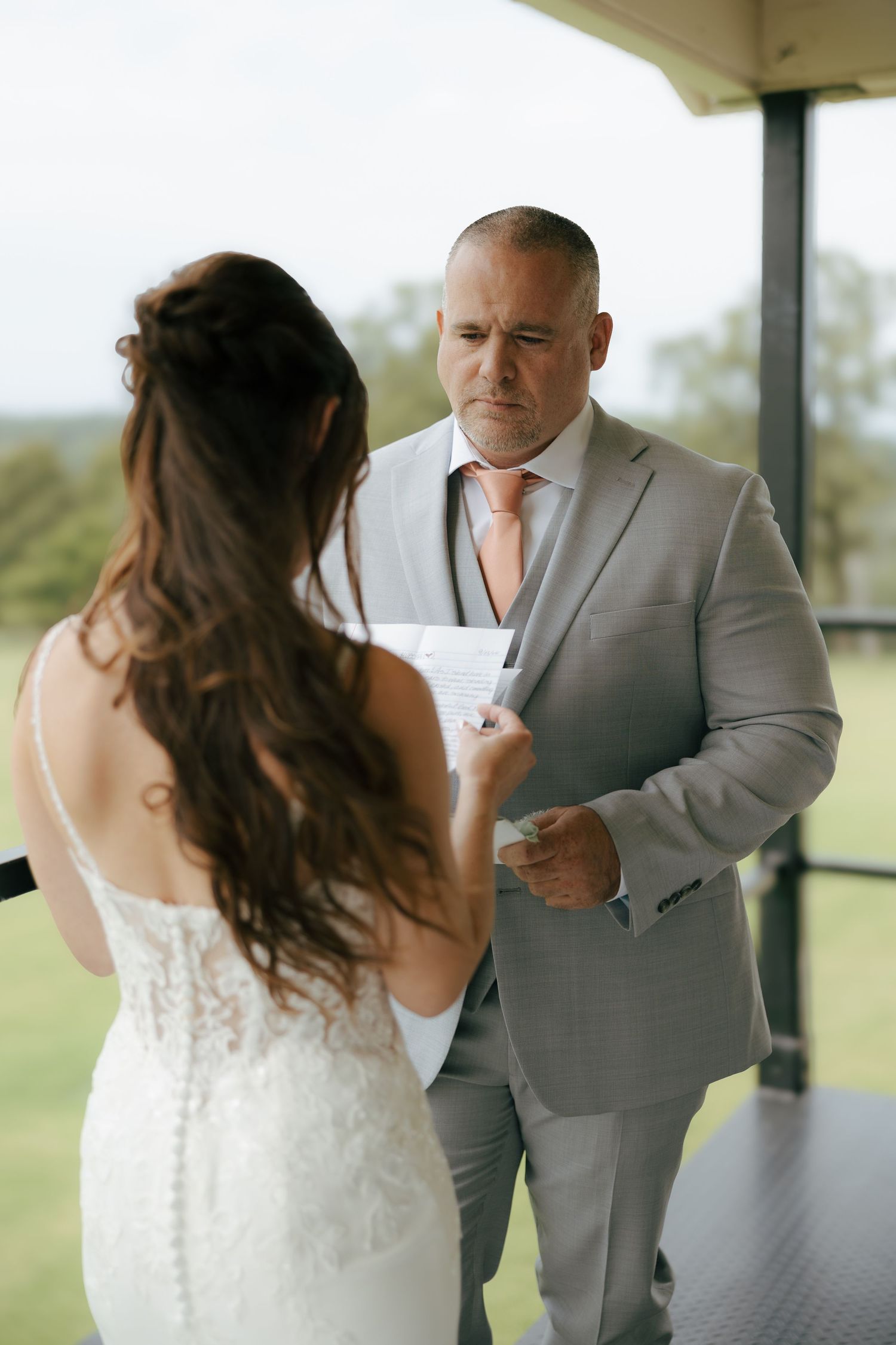 A series of emotional first look photos showing a bride and groom sharing a touching moment at their wedding ceremony.