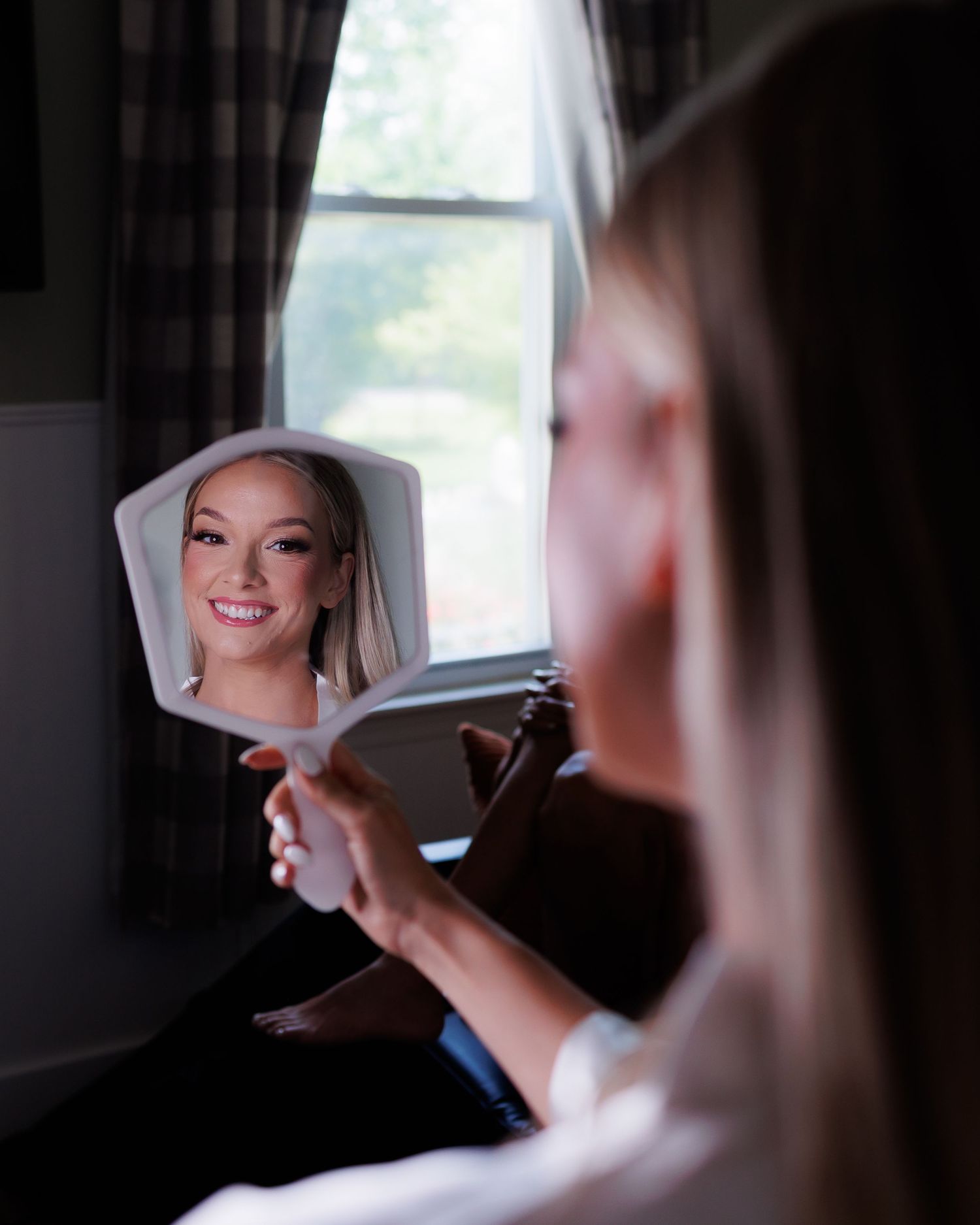 A series of wedding preparation photos showing a nurse's cap being adjusted in dark atmospheric lighting.
