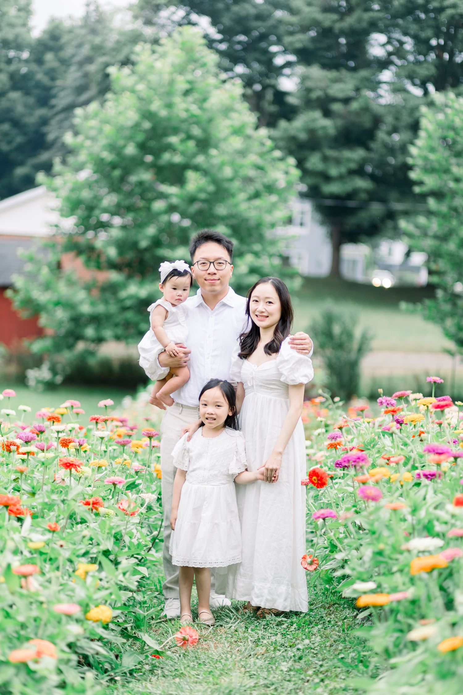 A loving family portrait outdoors in a blooming poppy garden showcasing playful moments among beautiful flowers.