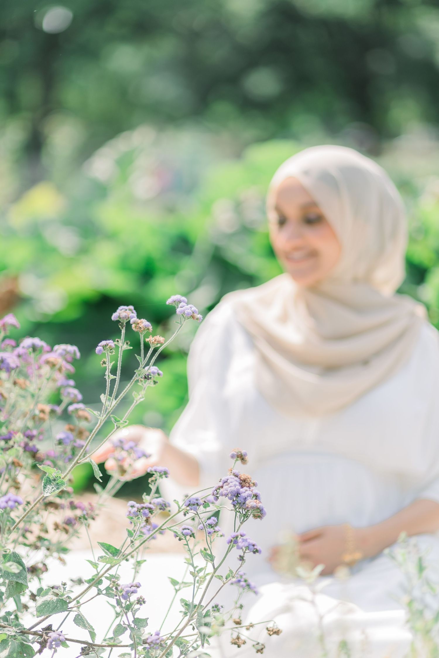 Soft focus photo series of someone in white hijab sitting among delicate purple wildflowers in a garden setting.