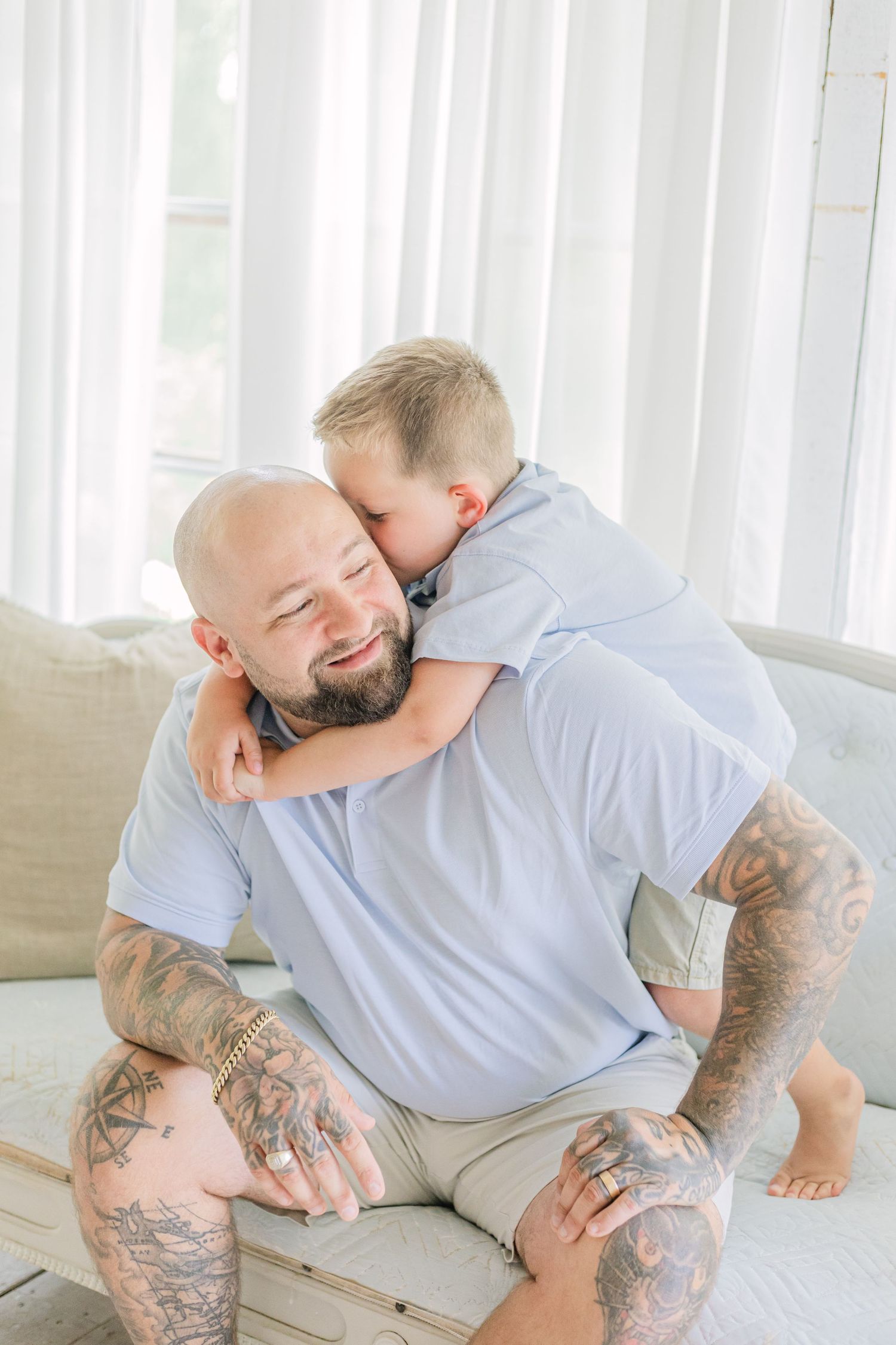 A series of four tender moments between parent and child showing playful interaction on a white couch.