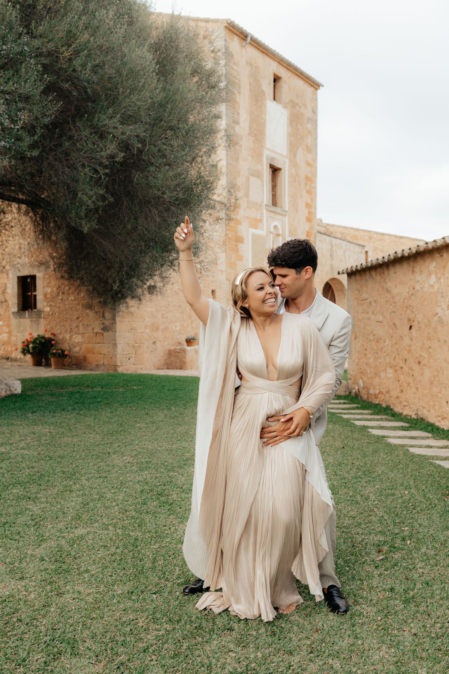 Celebration of love between a couple on the grounds of a beautiful Mediterranean estate.