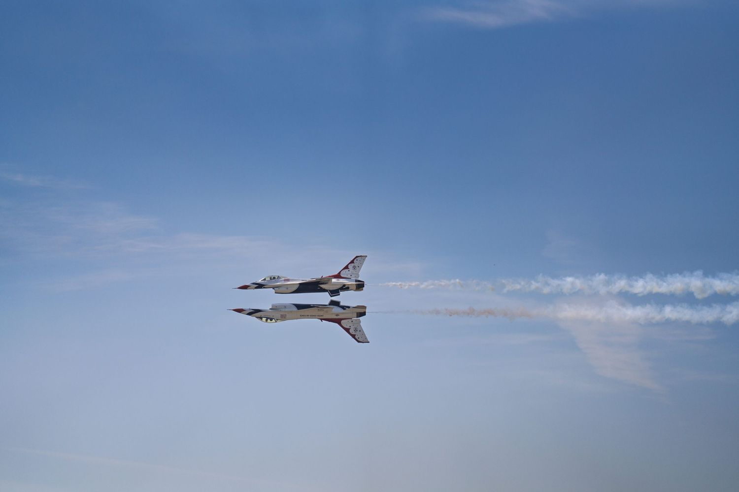 U.S. Air Force Thunderbirds F-16 performing an aerial maneuver at the SJAFB airshow.