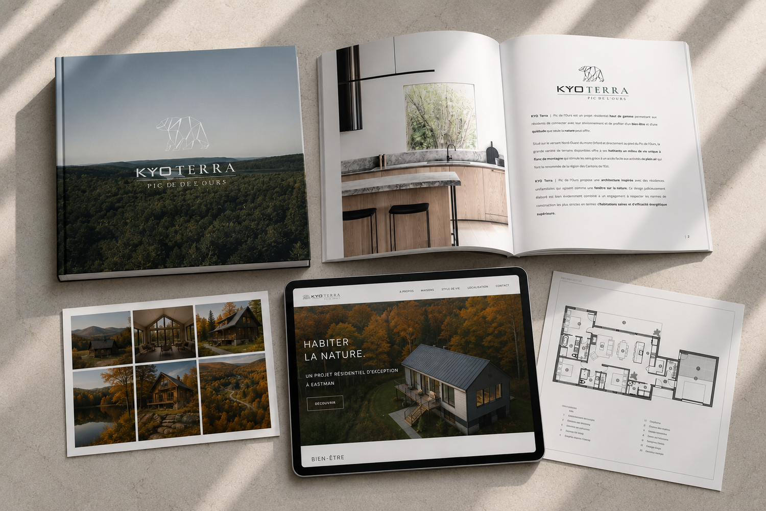 Kyo Terra real estate brochure and tablet mockup displaying nature cabin property with floor plans.