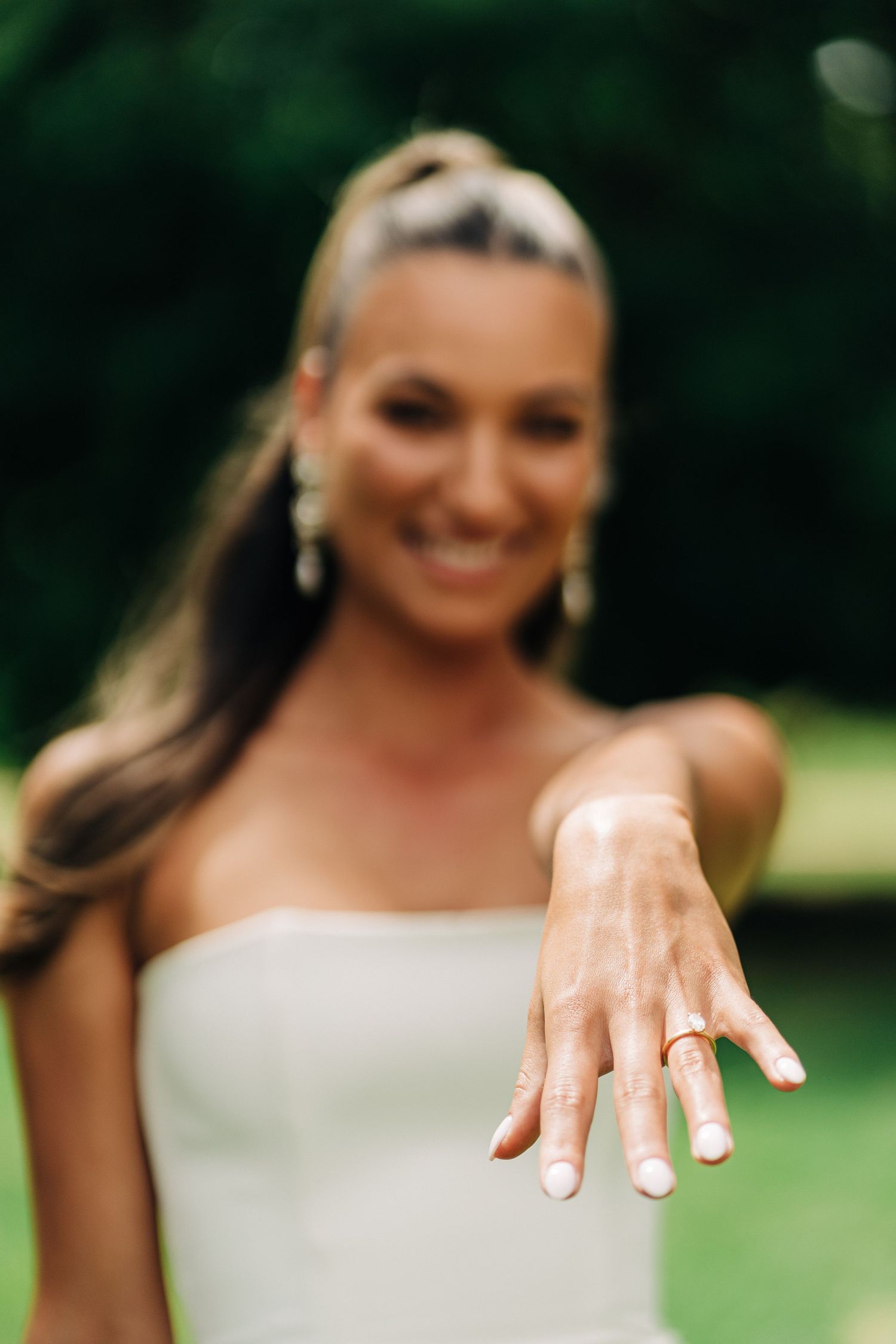 Bride to be showing her engagement ring at her bridal shower