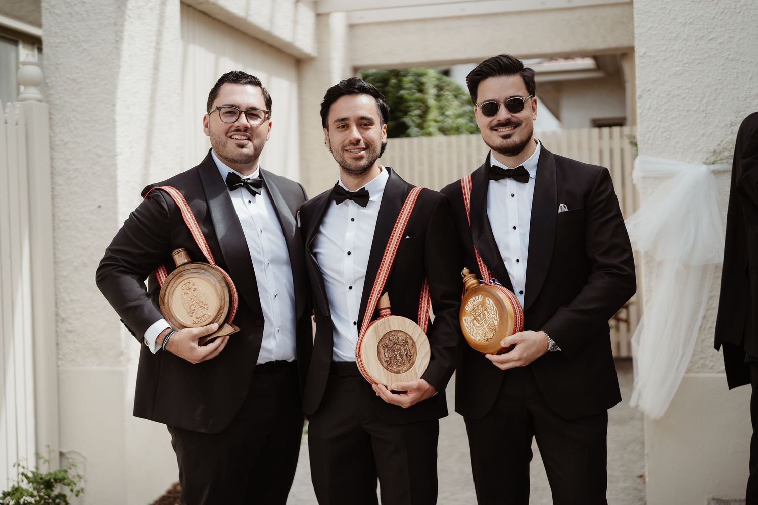 Groom and groomsmen in burgundy suits before a Melbourne wedding