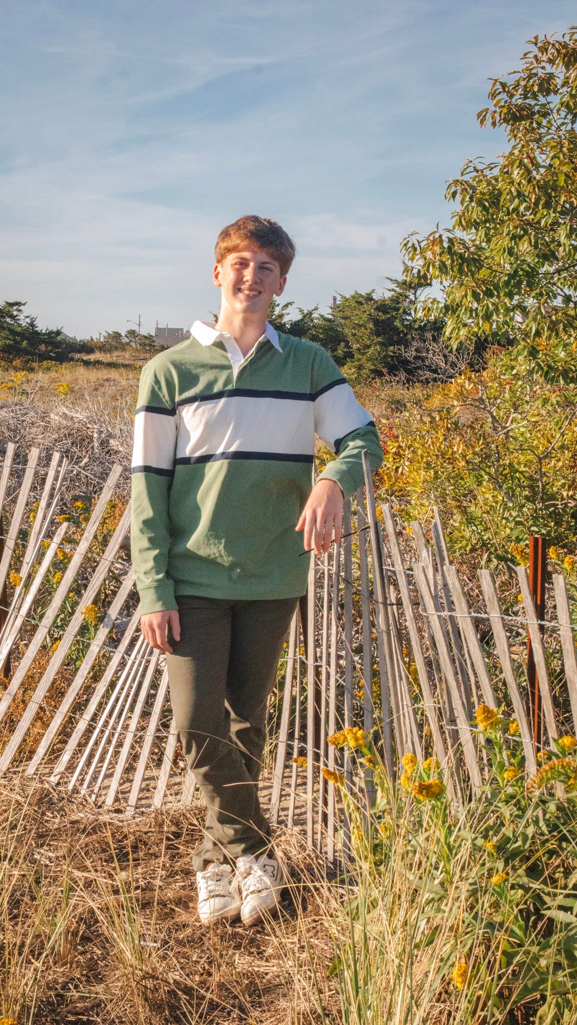 A series of outdoor portraits in a rustic setting with a wooden fence and autumn foliage in the background.