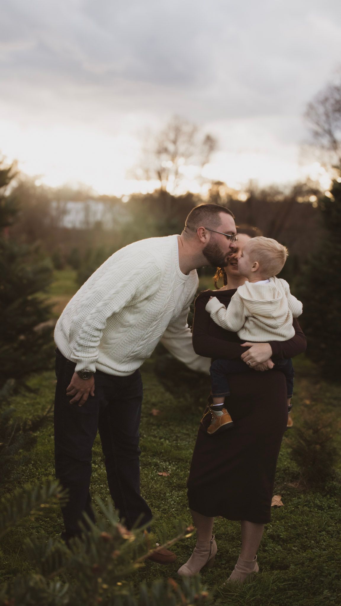 A sequence of photos showing two people sharing sweet moments together at sunset in a garden setting.