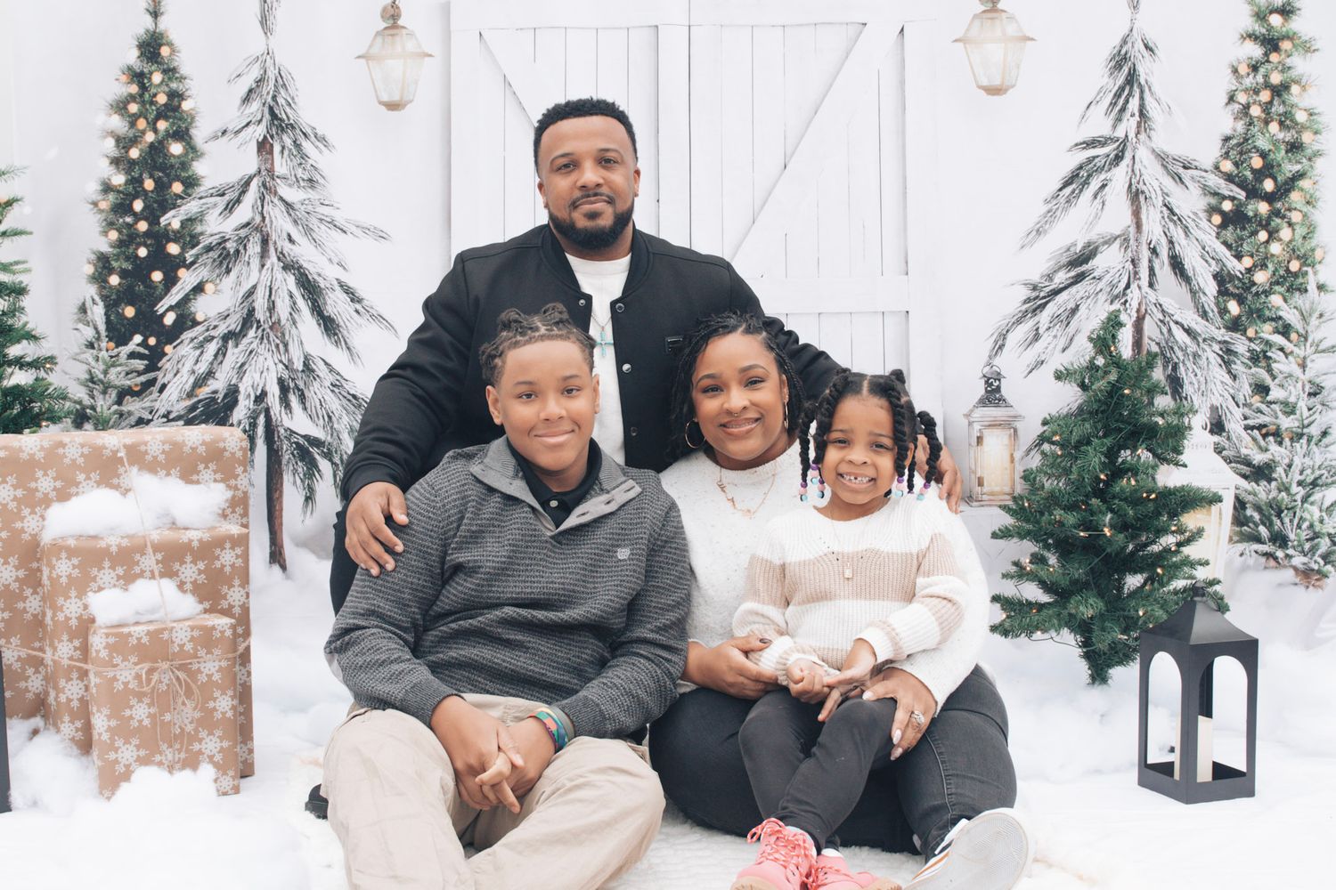 A collage of winter family portraits with snowy backdrops and coordinated black and white outfits.