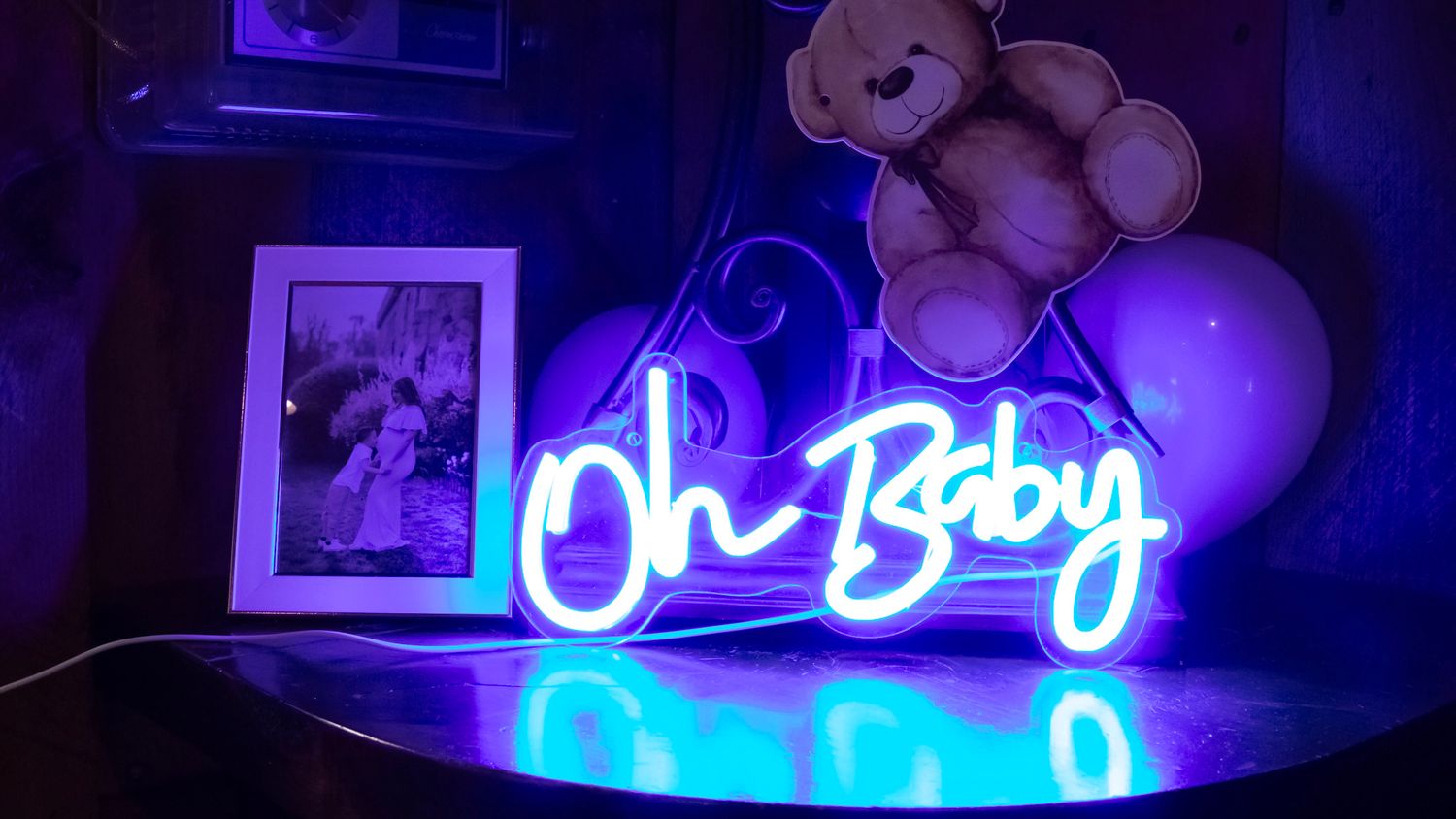 Blue neon lighting illuminates a room with decorative elements.