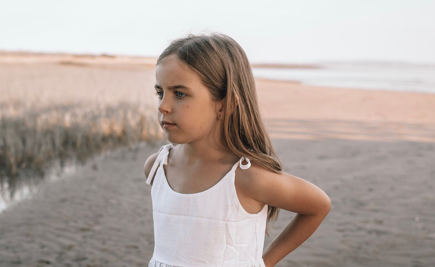 A series of candid outdoor portrait shots showing a woman in casual attire against natural backgrounds.