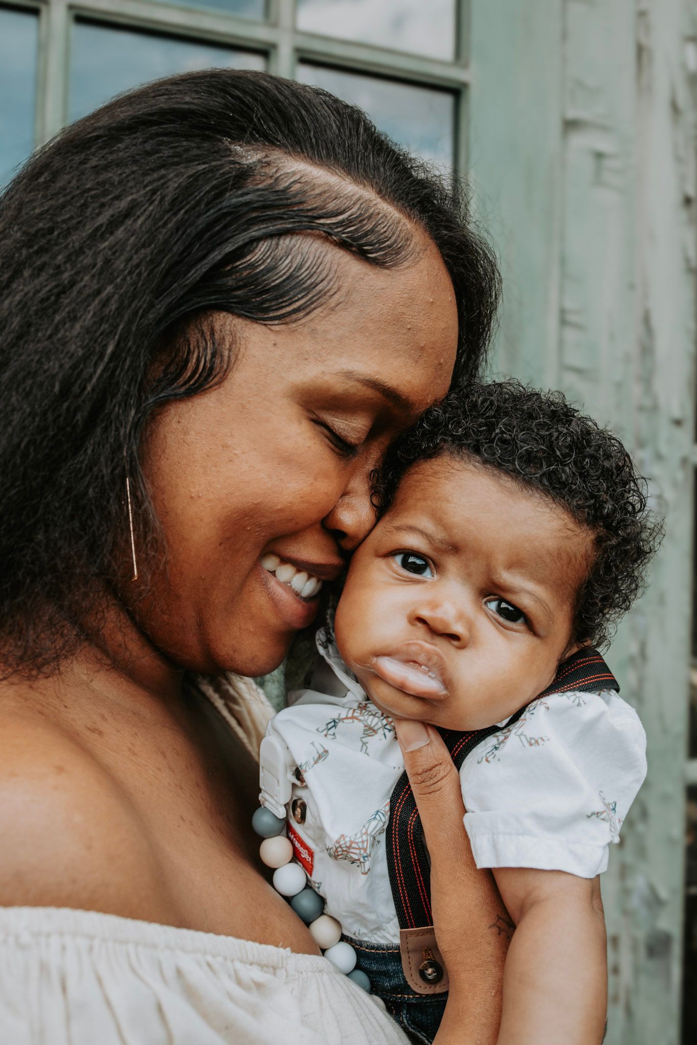 A tender moment captured in a series of photos showing a mother and child embracing and sharing joyful expressions.