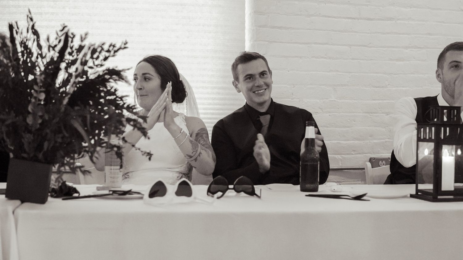 A group of people seated at a long conference table during a business meeting.