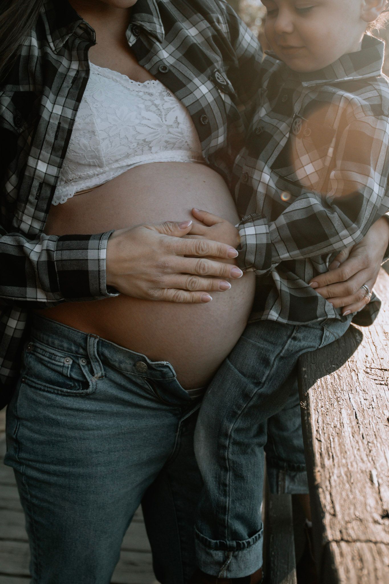 A series of photos showing hands gently cradling a pregnant belly while wearing a plaid shirt and jeans.