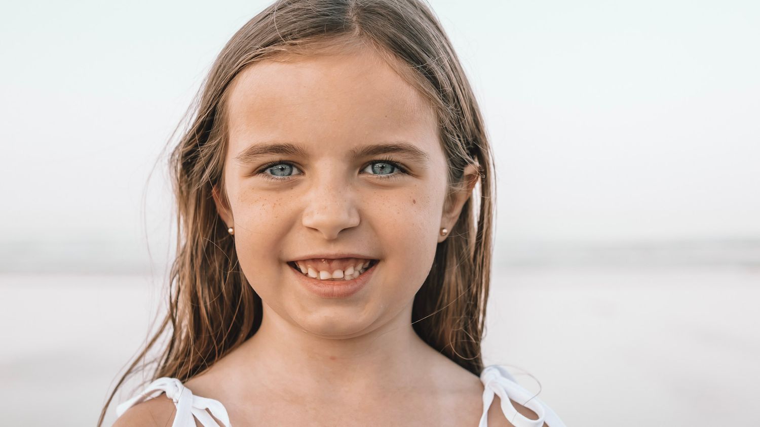 A collection of close-up portrait photographs showing a woman with natural lighting and soft expressions.