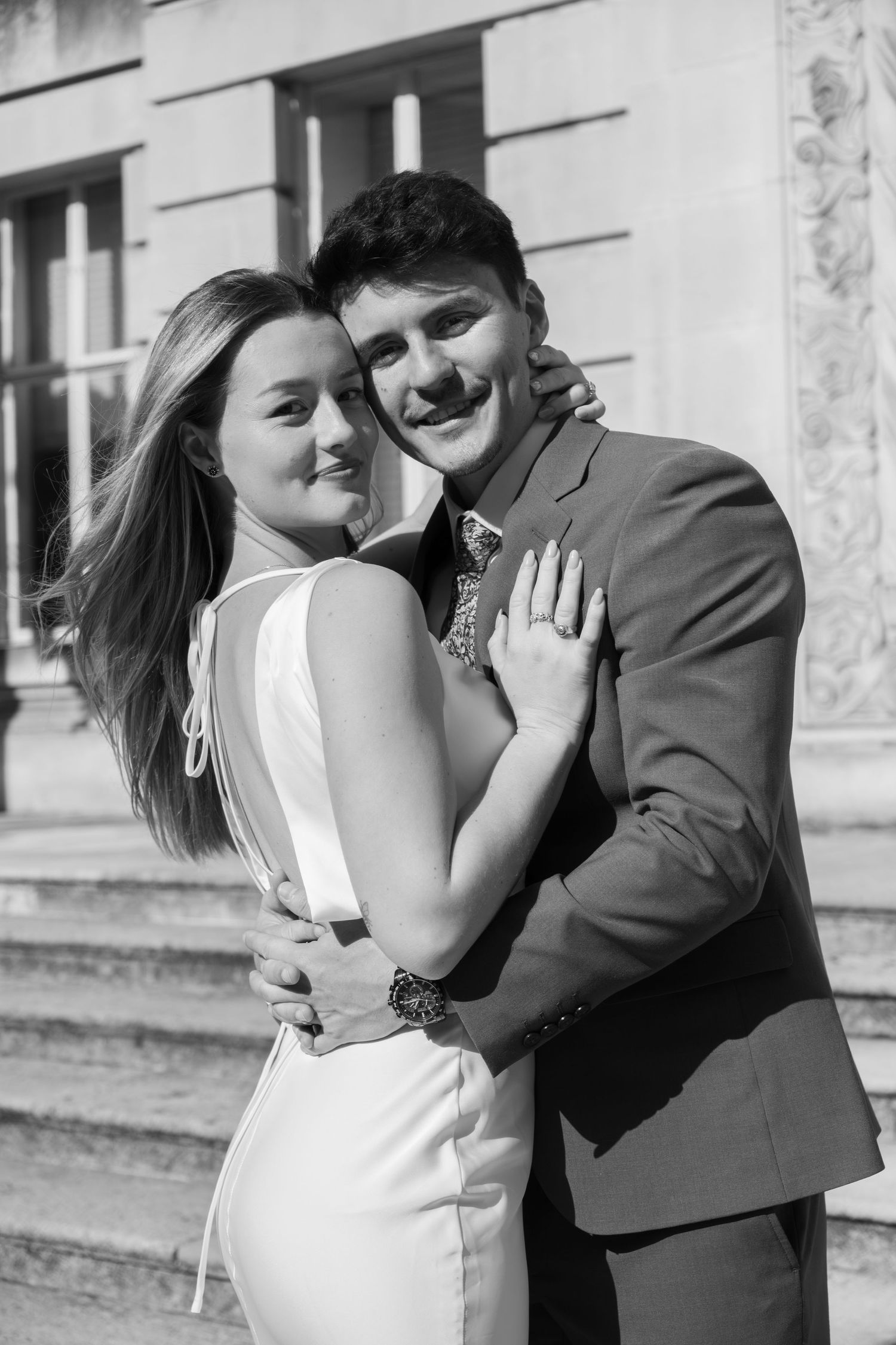 Black and white candid sequence of newlyweds embracing and laughing.