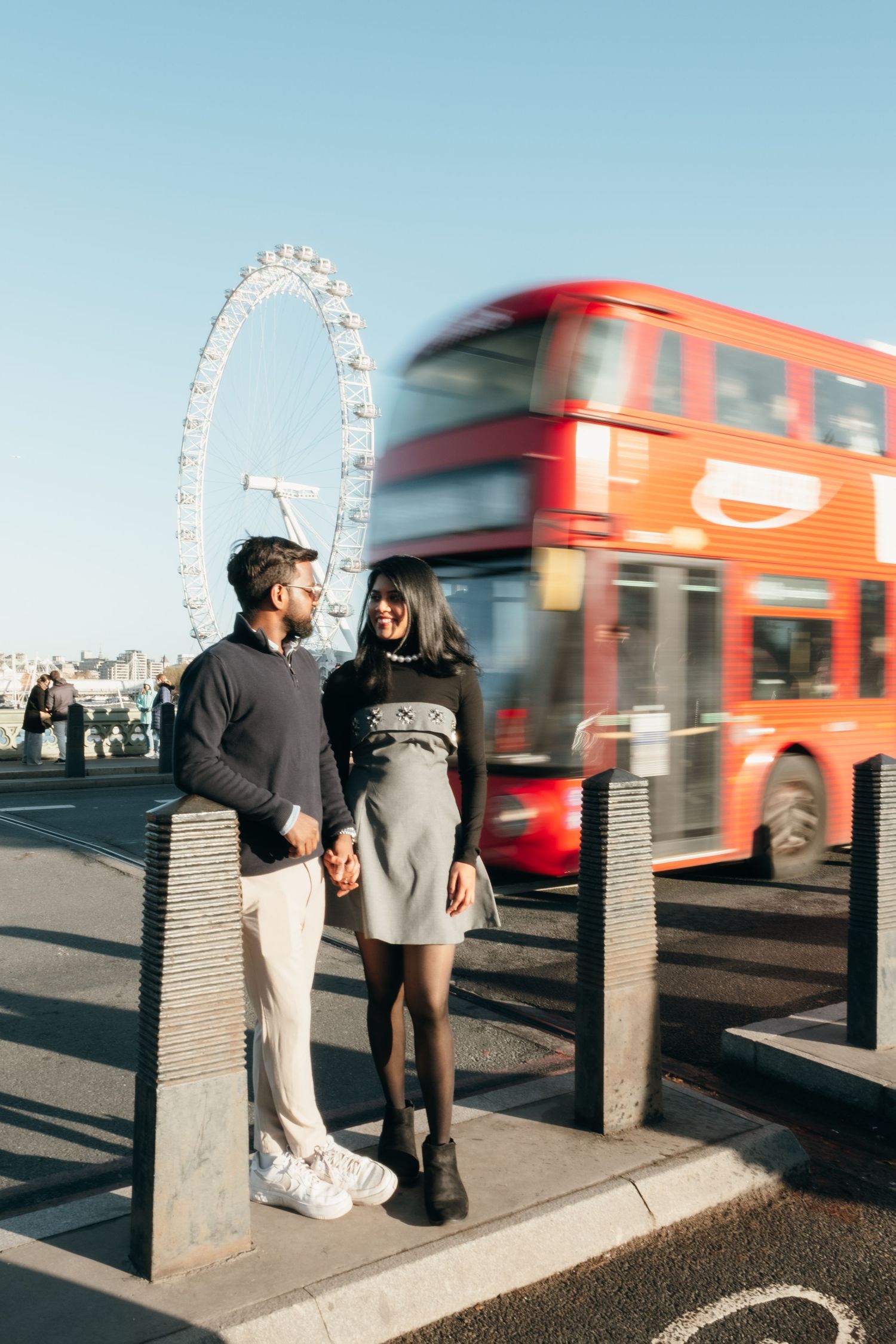Urban engagement photos with red London bus motion blur and the London Eye in the background.