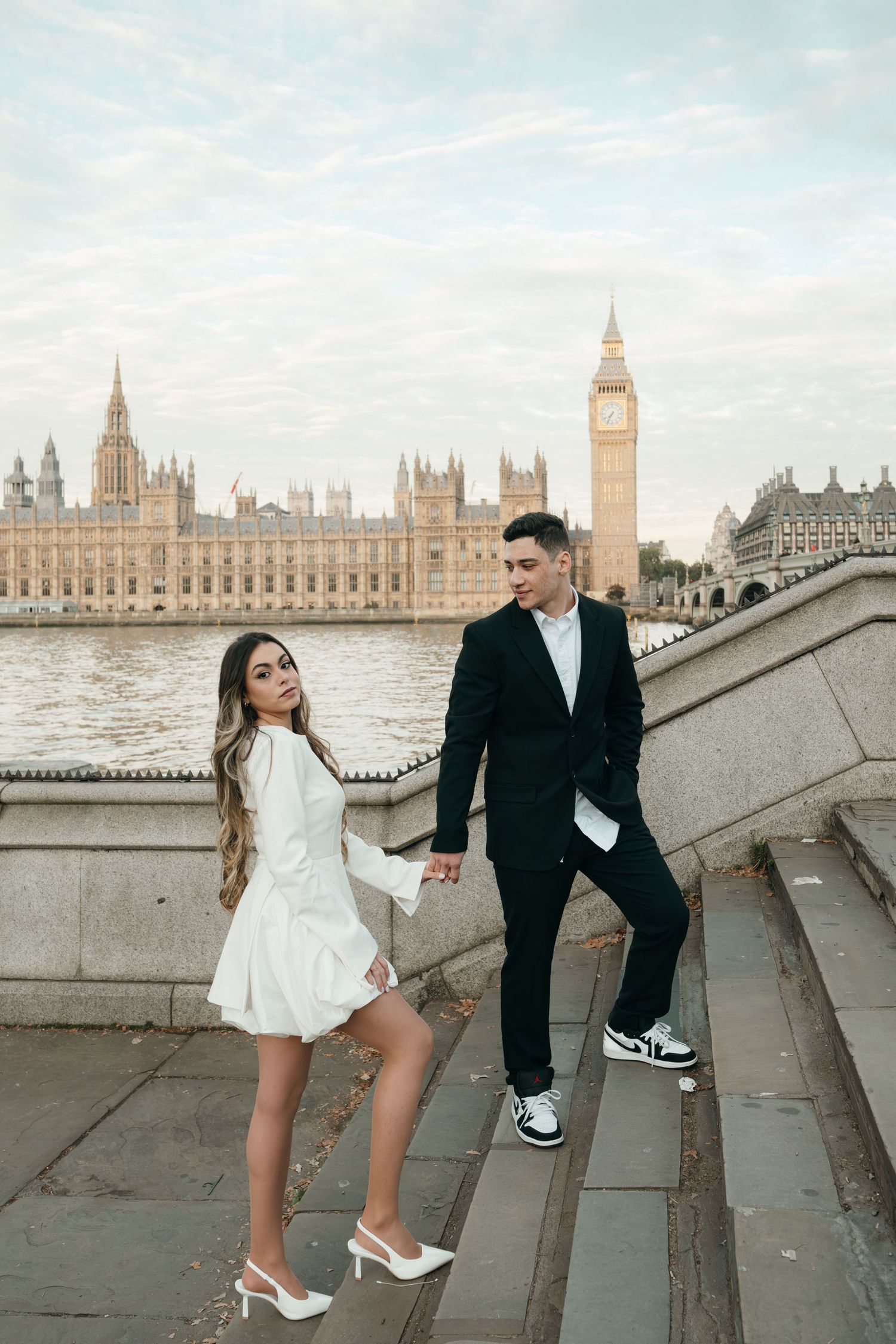 A romantic photoshoot near the Houses of Parliament in London with iconic Big Ben in the background.