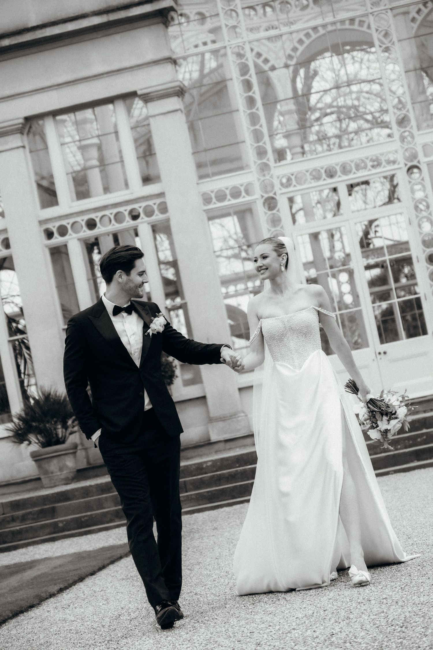 Elegant black and white wedding photography sequence showing a couple in formal attire outside a historic building.