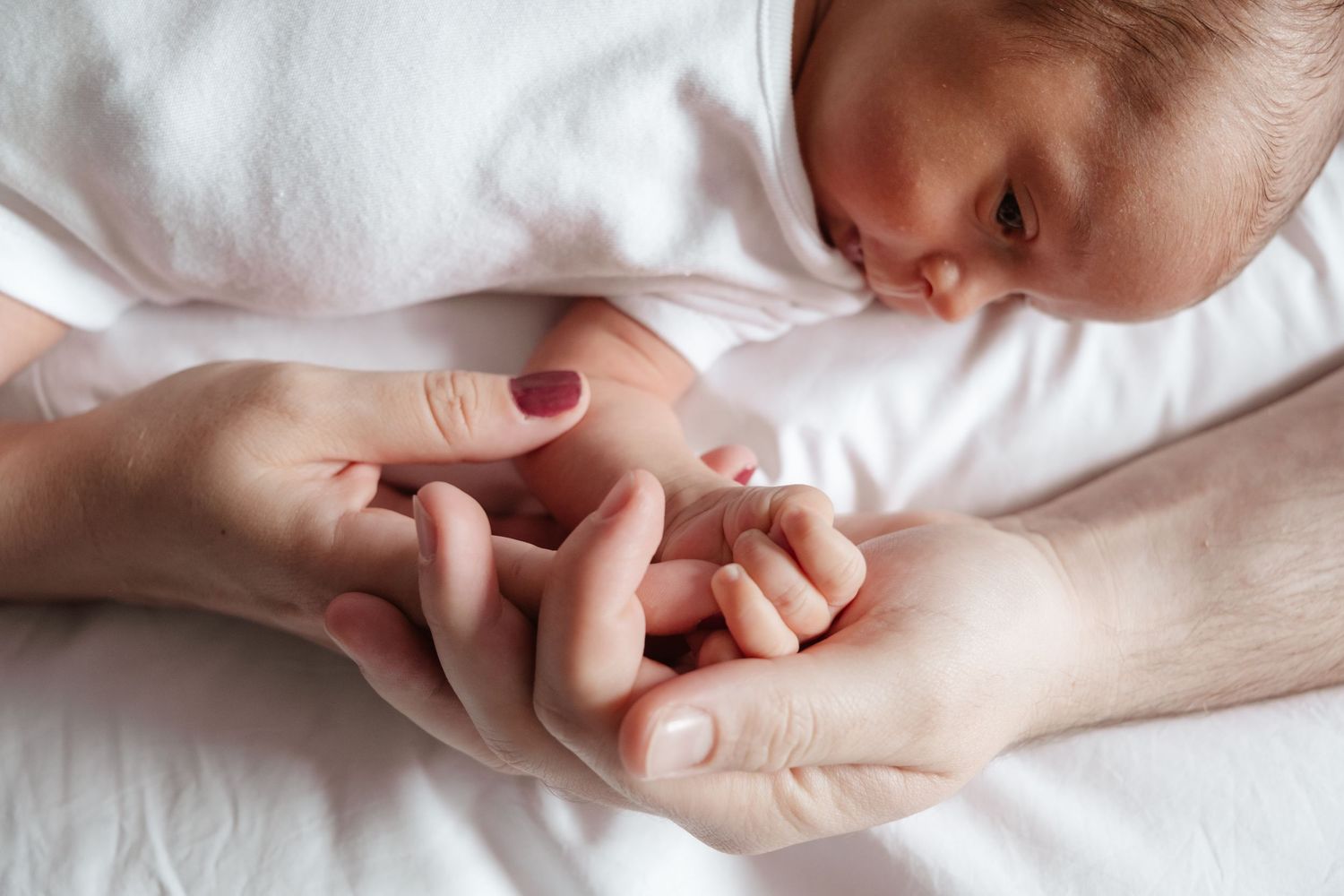 Artistic series of tender moments captured in soft white tones.