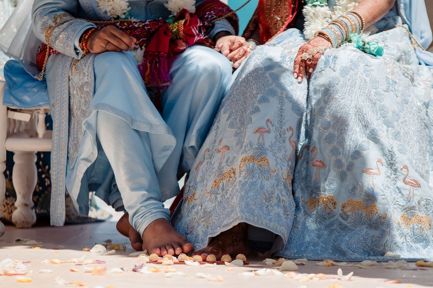 Detail shot of traditional Indian wedding attire and decorative elements.