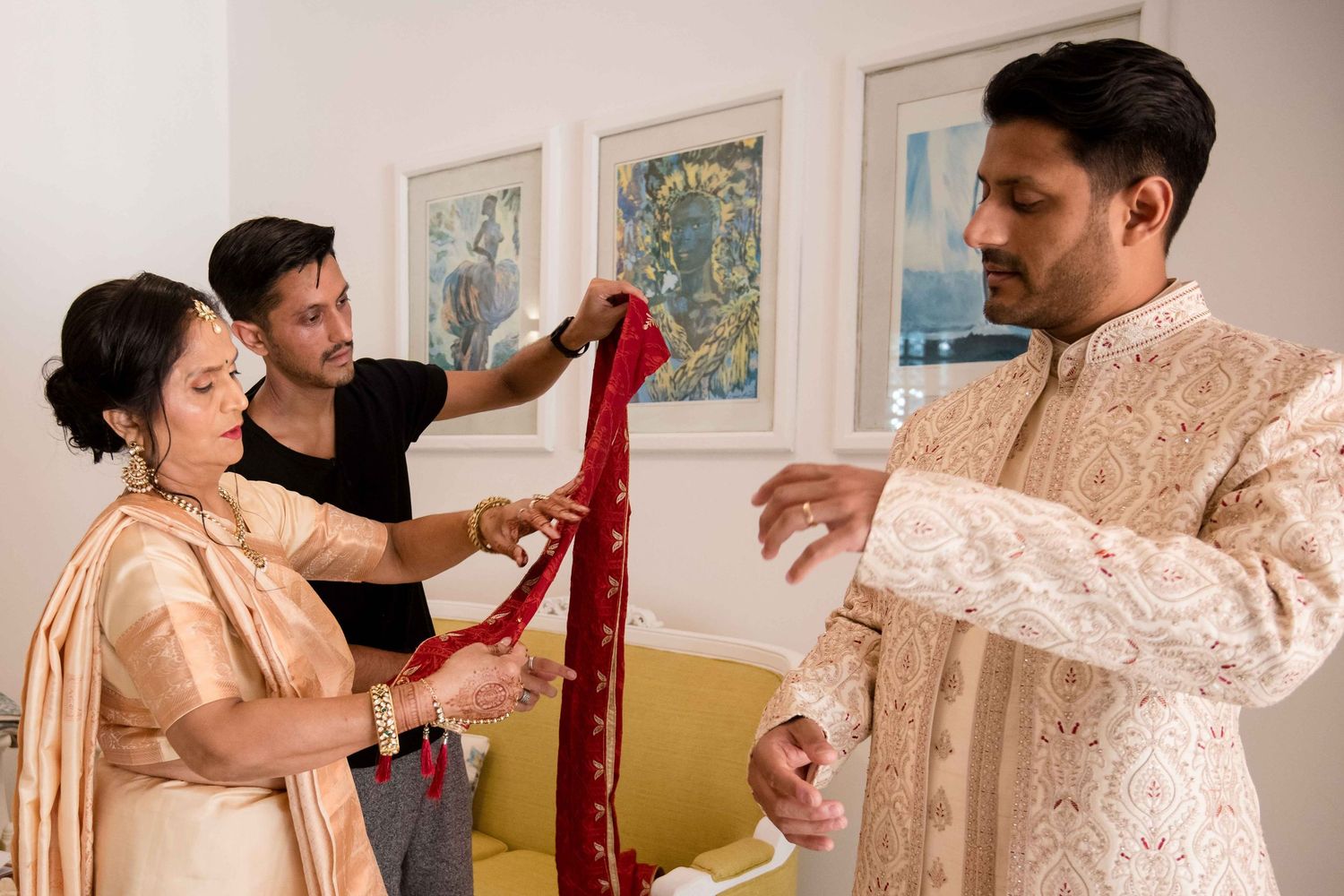A series of photos showing a traditional Indian wedding ceremony with participants in elegant cream and red attire.