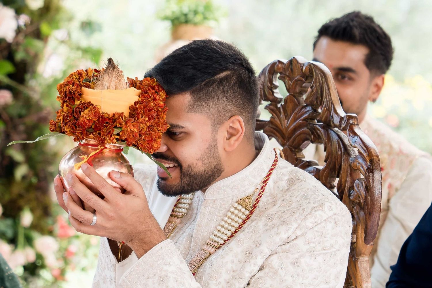Wedding ritual involving decorative elements during a traditional ceremony.