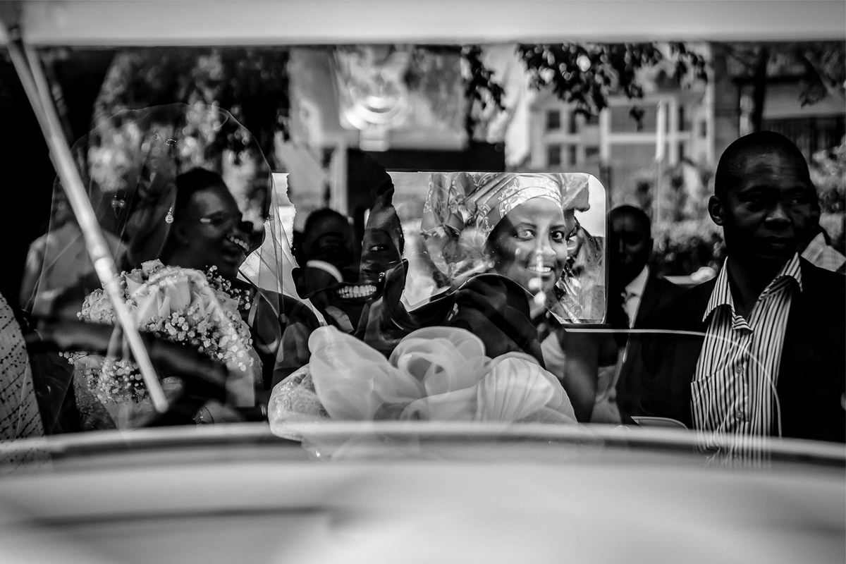 Wedding reception candid moments captured in black and white photography.