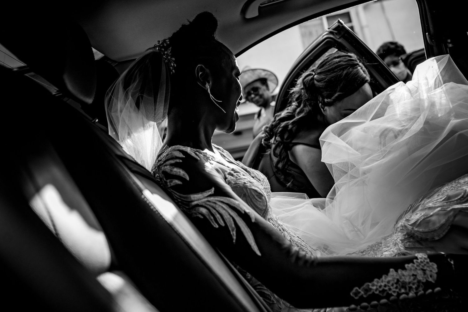 Dramatic black and white image capturing a quiet moment in a car.