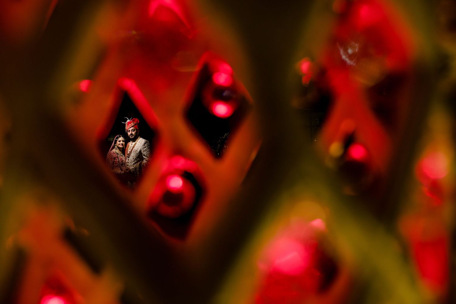Abstract red bokeh lights creating a festive holiday atmosphere.