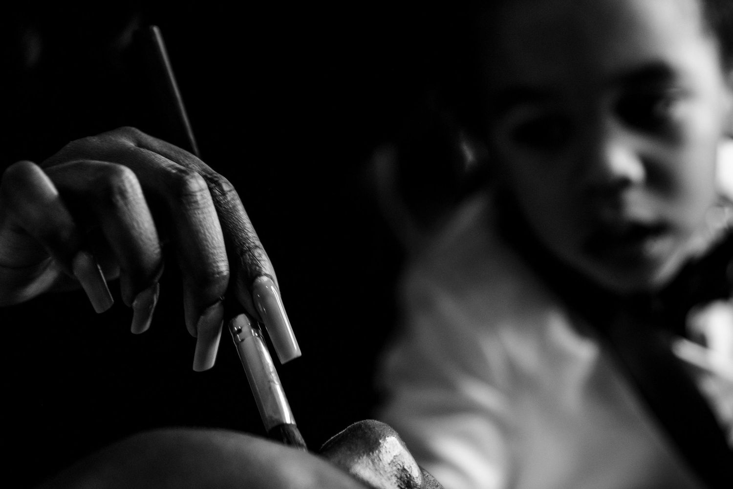 Dramatic shadows and lighting create intimate moments in this black and white wedding series.