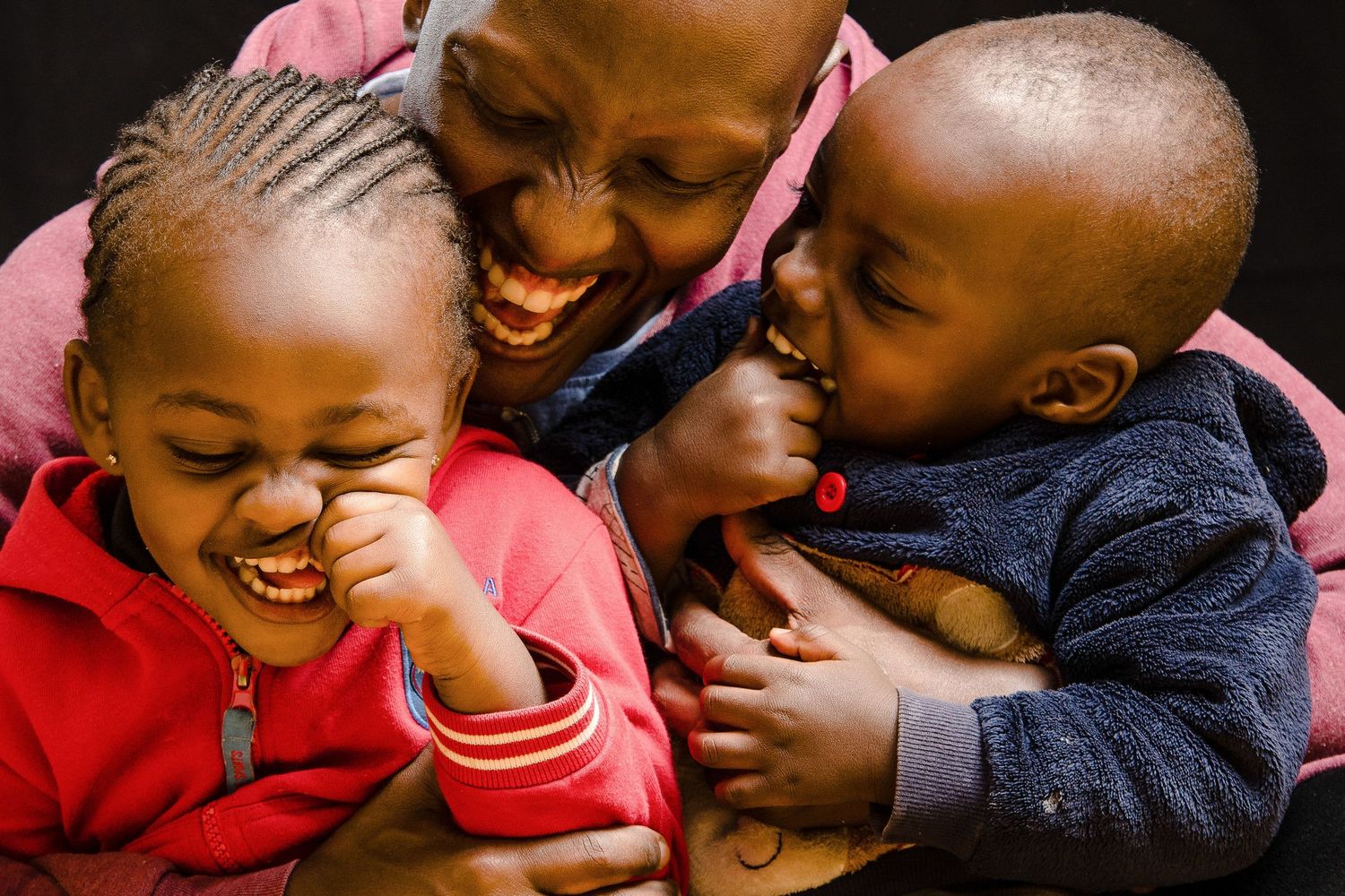 Candid moments of children playing and laughing together in casual portraits.