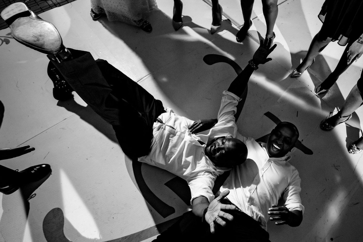 Dynamic black and white dance floor shots capturing movement and celebration.