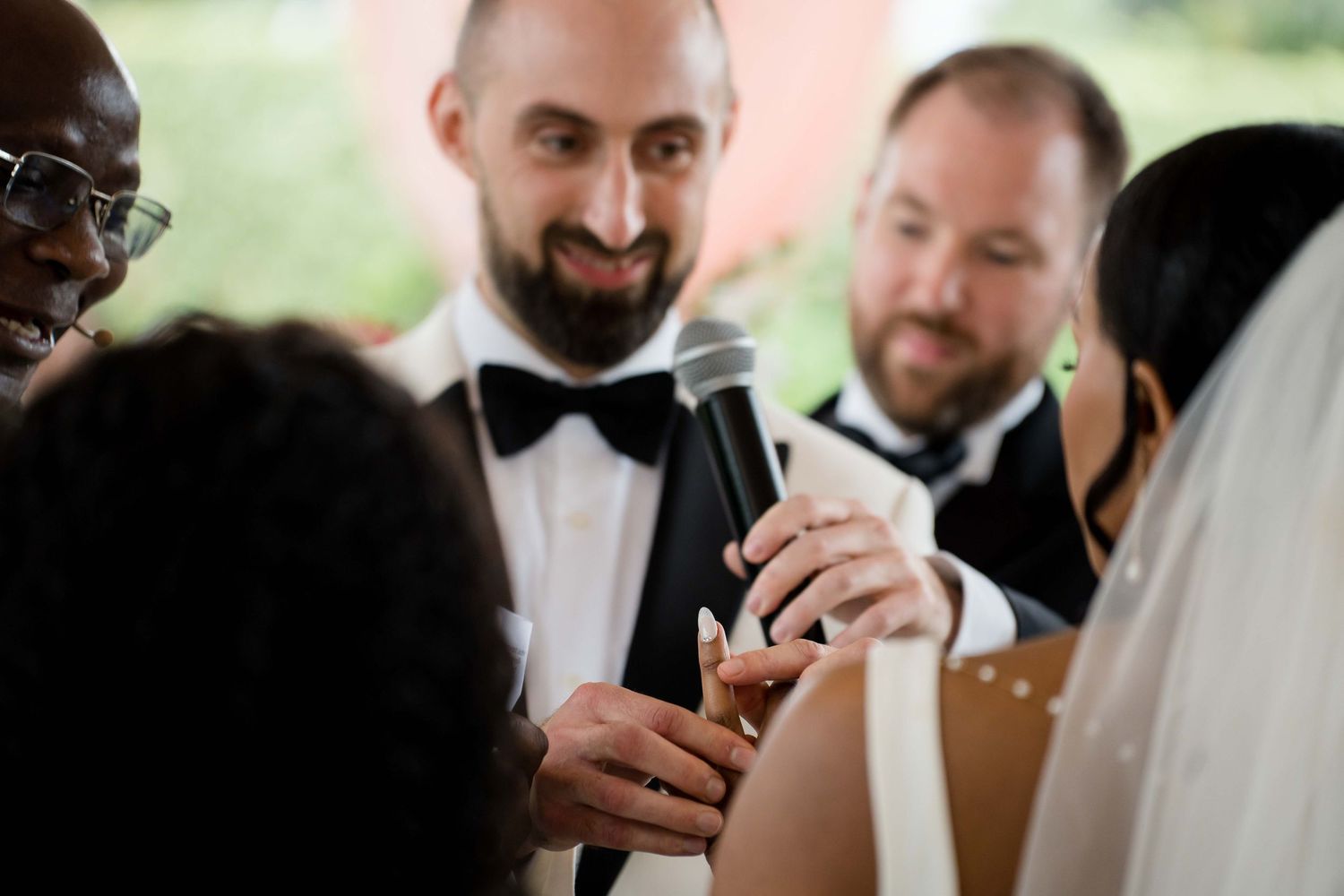 A group of people in formal attire toasting with champagne glasses during a celebration event.