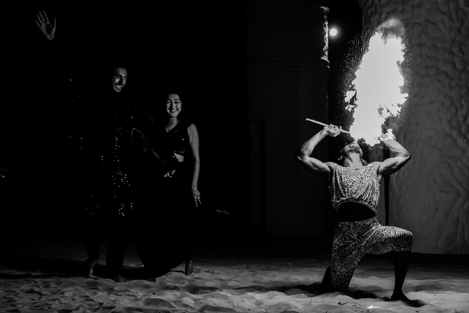 A series of black and white dance performance photographs showing silhouettes of dancers in dramatic poses and lighting.