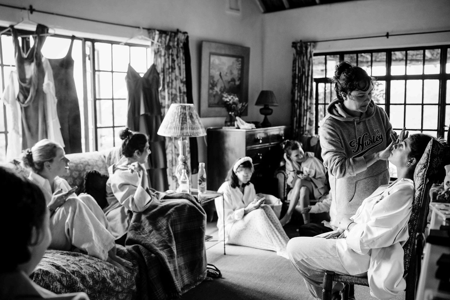 A black and white photo series showing people dancing together in what appears to be a social dance class or workshop.
