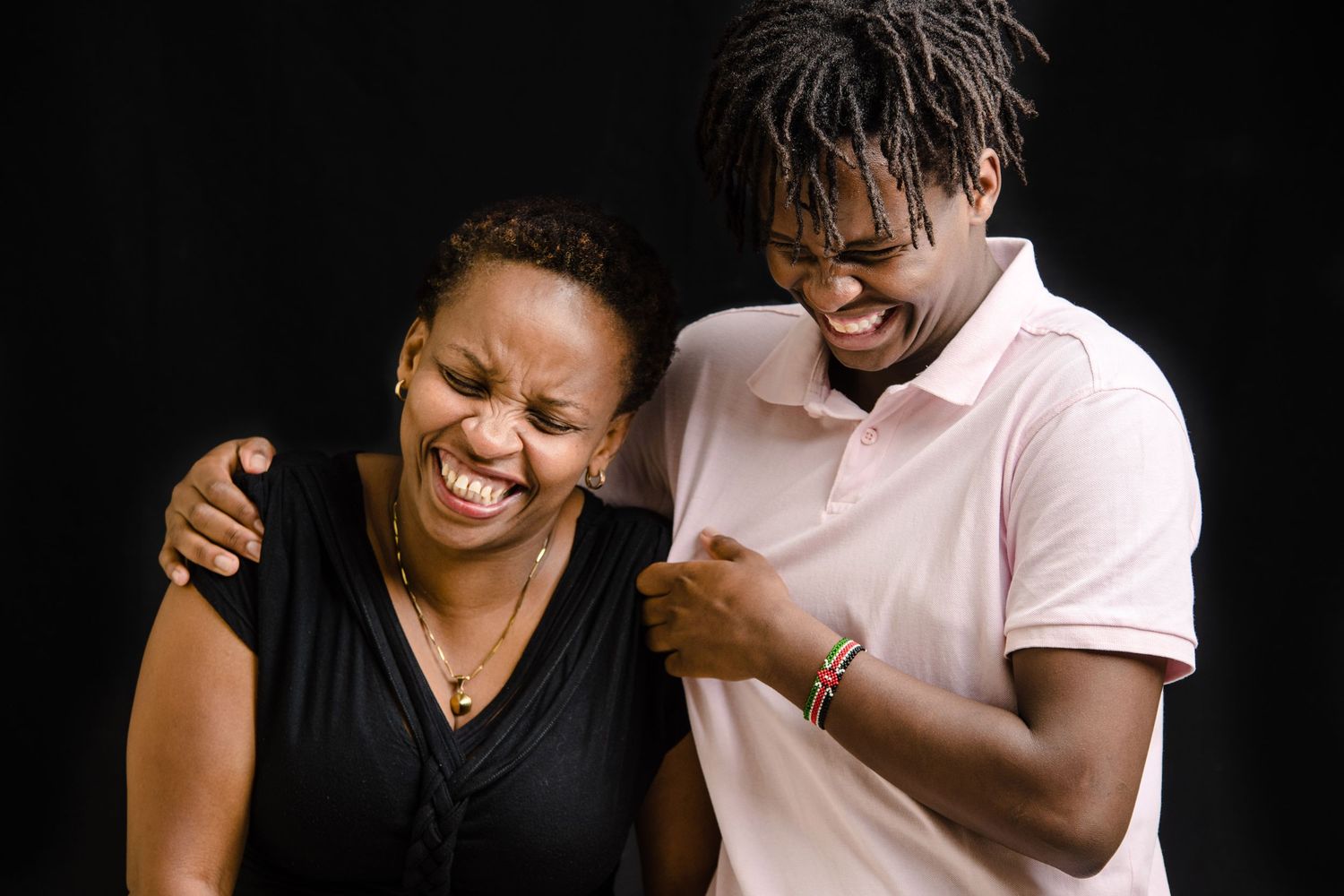 Black and white portraits capturing candid laughter and playful moments between people.